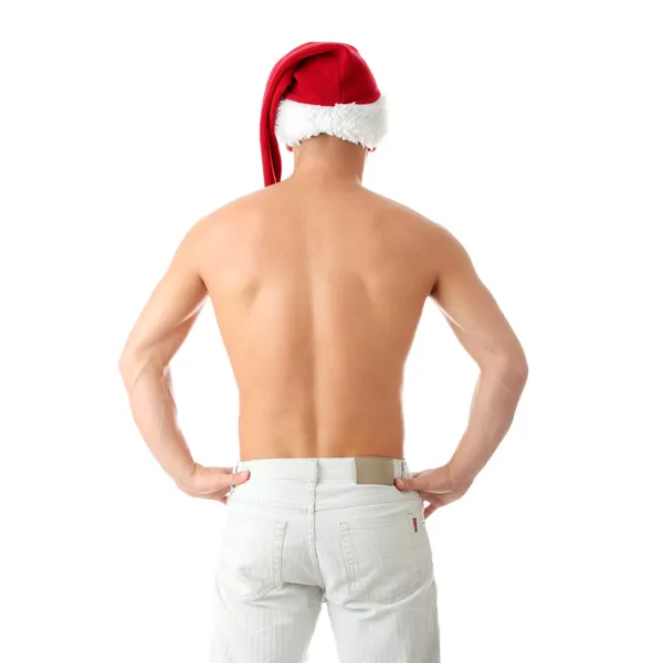 Sexy muscular homem vestindo um Papai Noel chapéu — Fotografia de Stock