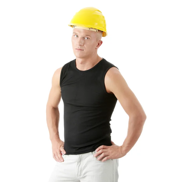 Jovem construtor bonito em capacete amarelo . — Fotografia de Stock
