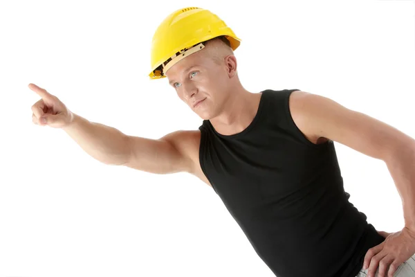 Builder in yellow helmet pointing up. — Stock Photo, Image