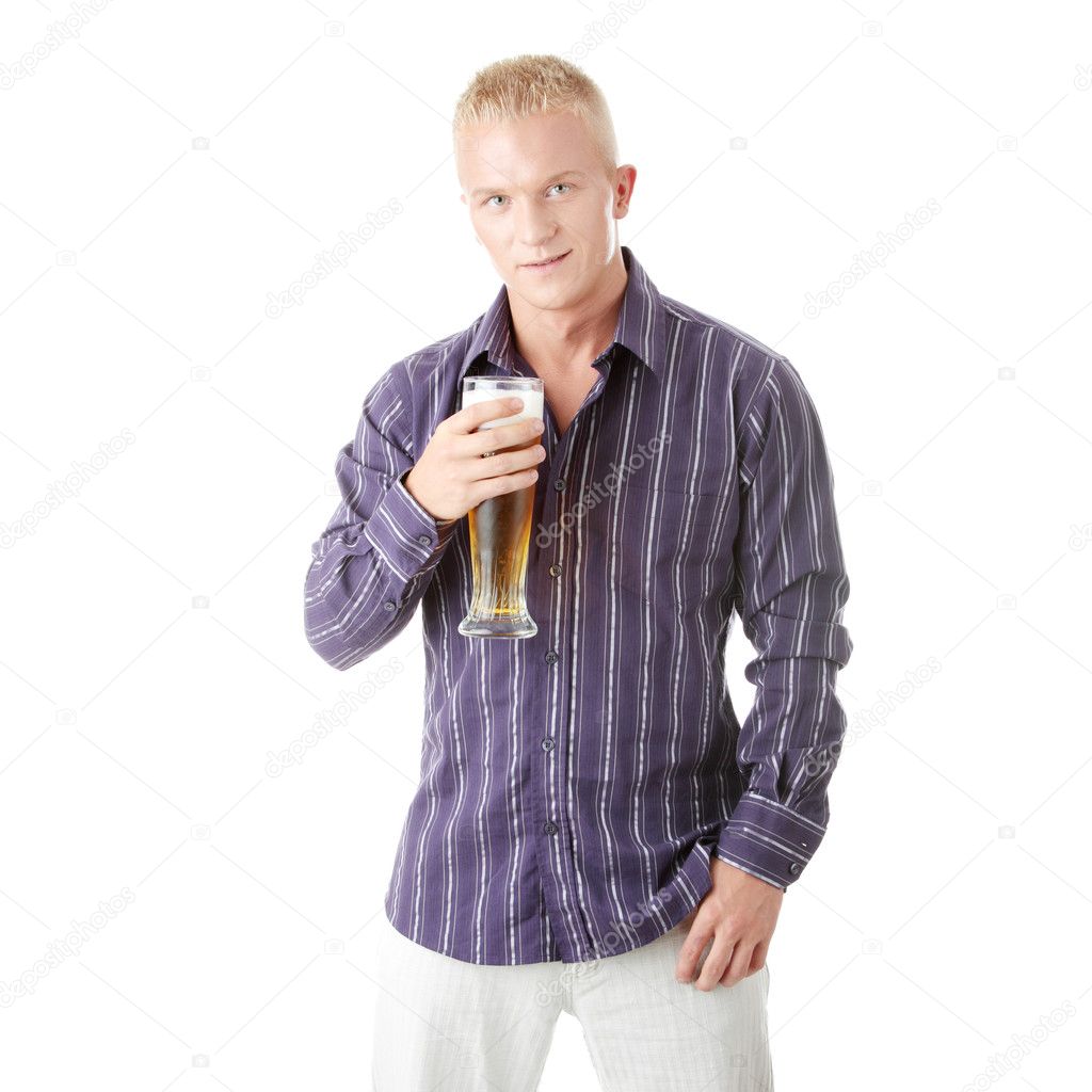 Happy young man holding a glass of beer — Stock Photo © piotr_marcinski ...