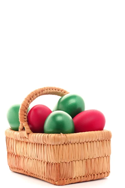 Easter egg in wicker basket — Stock Photo, Image
