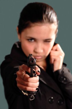 The young girl with a pistol clipart