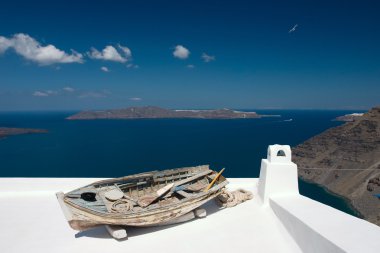 Old rowing boat on the roof clipart