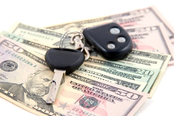 Car key and dollars isolated on white — Stock Photo, Image