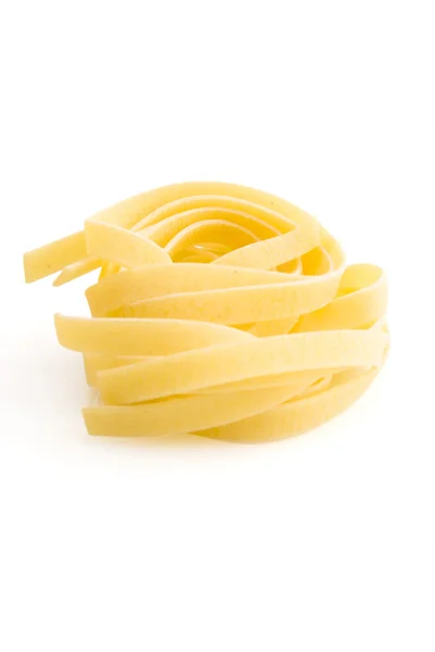 Row dry nest pasta on white — Stock Photo, Image