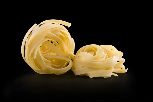 Två raw torr boet pasta — Stockfoto