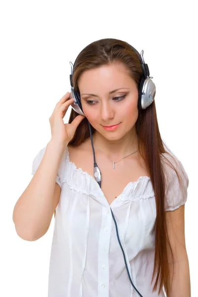 Meisje in hoofdtelefoon luistert — Stockfoto