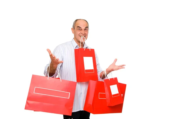 Sorriso homem trazer sacos de papel lote — Fotografia de Stock