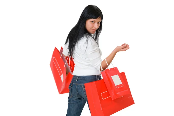 Girl gazdaság piros csomag a kezében — Stock Fotó