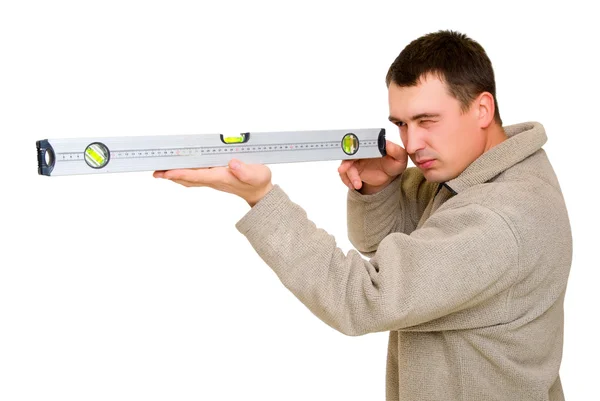 Man looking to level tool — Stock Photo, Image