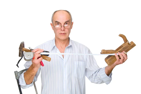 Człowiek z narzędziami w rękach — Zdjęcie stockowe