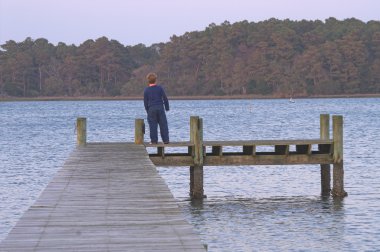 Boy on a Pier clipart