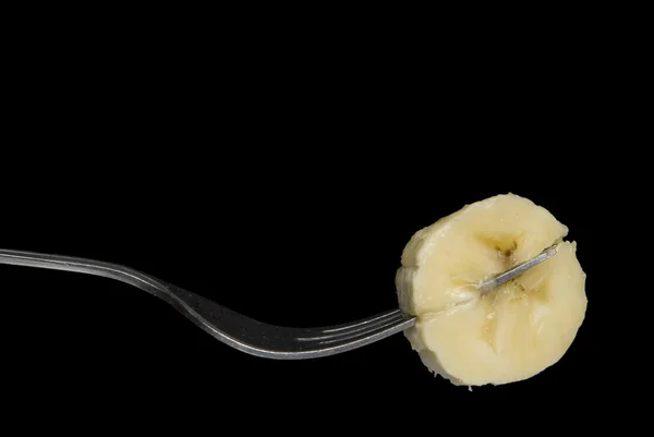 Fatia de banana no garfo — Fotografia de Stock