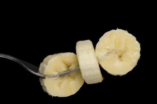 Rebanadas de plátano en tenedor —  Fotos de Stock