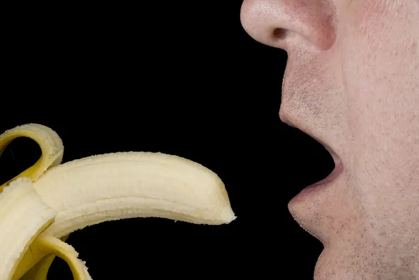 Jedzenie banana — Zdjęcie stockowe