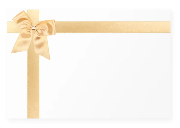 Arco de presente de ouro no cartão branco — Fotografia de Stock
