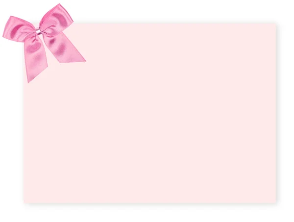 Etiqueta de presente rosa em branco com um arco — Fotografia de Stock