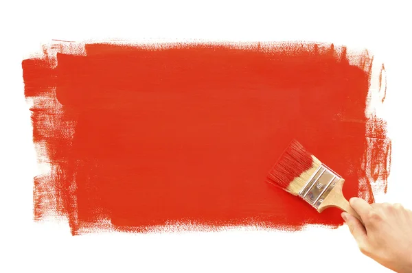 Malerei mit rotem Pinsel — Stockfoto