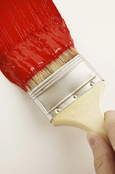 Pittura con pennello rosso — Foto Stock