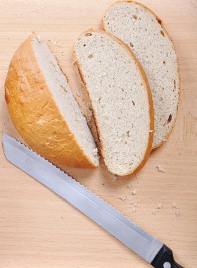 Three pieces of bread and the knife clipart