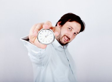 Young man with clock or watch in his hand clipart