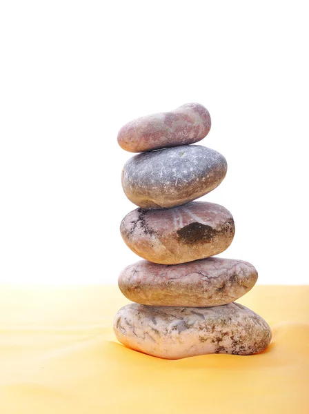 Balanced stones on yellow ground — Stock Photo, Image