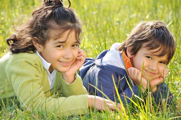 Happy childhood on green beautiful meado — Stock Photo, Image