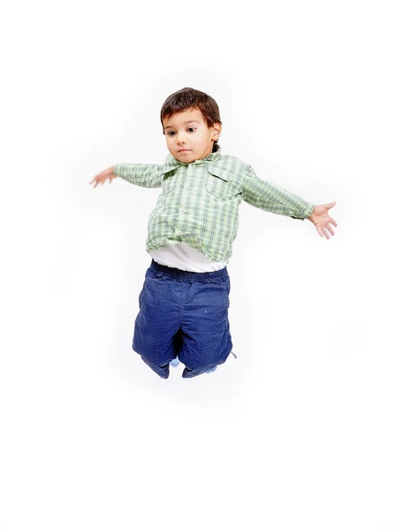 Molto felice bambino carino sta saltando — Foto Stock