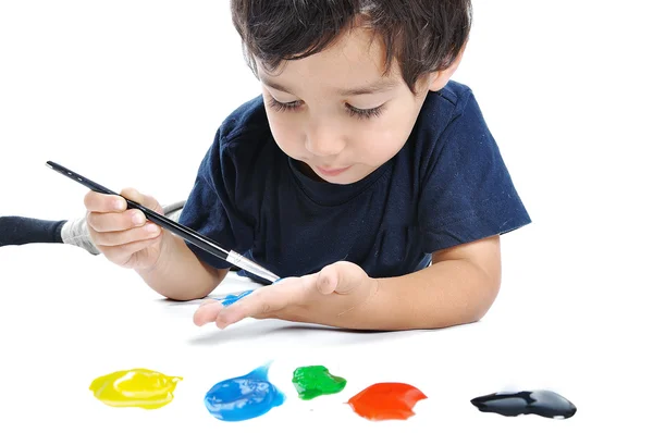 A little cute child with colors on white — Stock Photo, Image