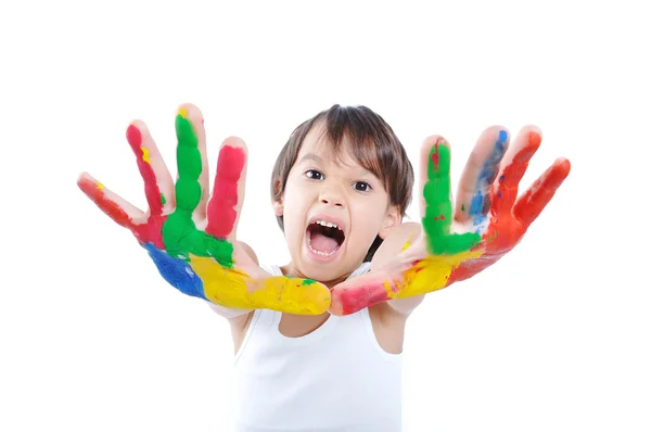 Malé roztomilé dítě s barvami na bílém pozadí — Stock fotografie