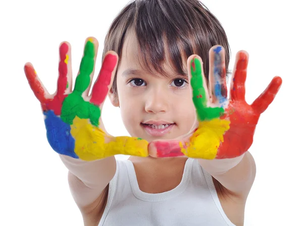 Een klein schattig kind met kleuren op wit Stockfoto