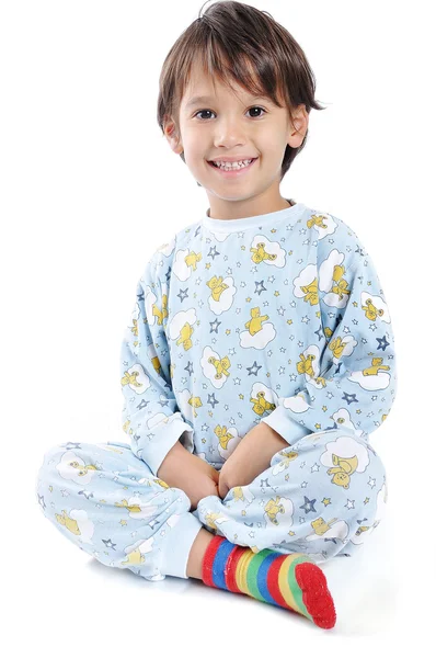 A little beautirul kid in pajamas Stock Picture