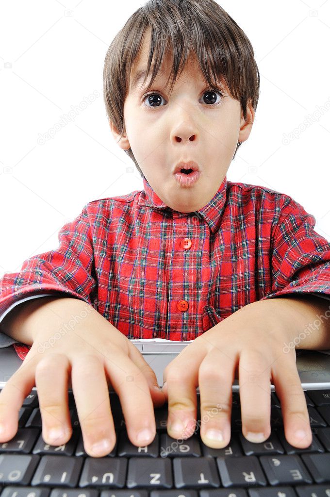 A little cute kid with a laptop isolated