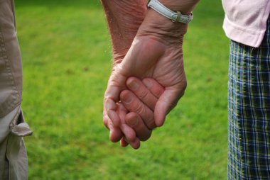 Senior couple holding hands clipart