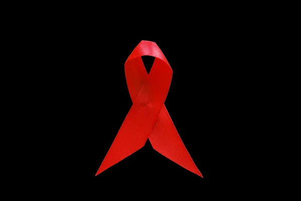 Красная лента помогает hiv — стоковое фото