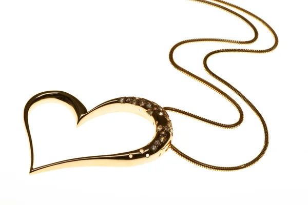 Golden heart shaped necklace on white — Stock Photo, Image