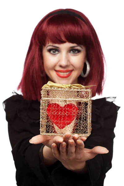 Happy girl with heart in a golden box — Stock Photo, Image