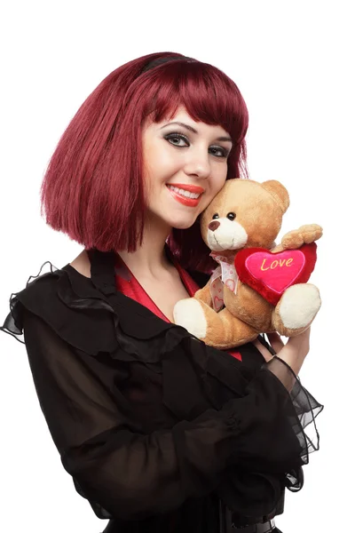 Gelukkig meisje met teddy bear in haar handen — Stockfoto