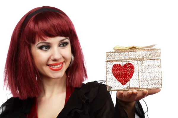 Happy girl with heart in a gift box — Stock Photo, Image
