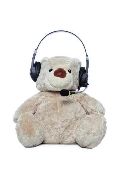 Cute Teddy bear with headset — Stockfoto