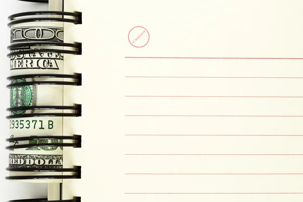 Hoja limpia de cuaderno con dólares —  Fotos de Stock