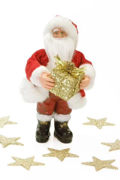 Weihnachtsmann mit goldenem Geschenk — Stockfoto