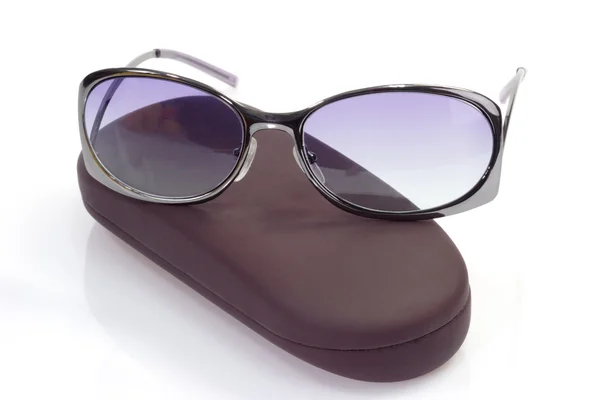 Sunglasses on spectacle case — Stock Photo, Image