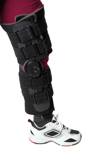 Knee in knee brace — Stock Photo, Image
