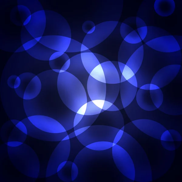 Cercles bleus sur un fond sombre — Photo