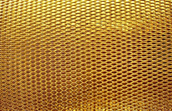 Fém hálós rács arany háttér — Stock Fotó