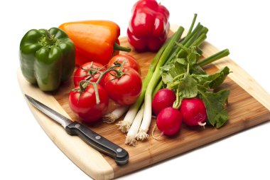 Vegetables on a kitcken bord clipart