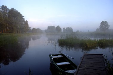 Dinghy in morning time clipart