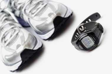 Sport watch and pair of trainers clipart