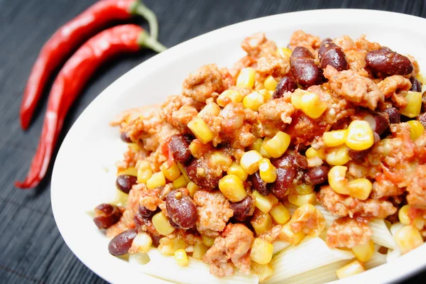 stock image Chili con carne and red peppers